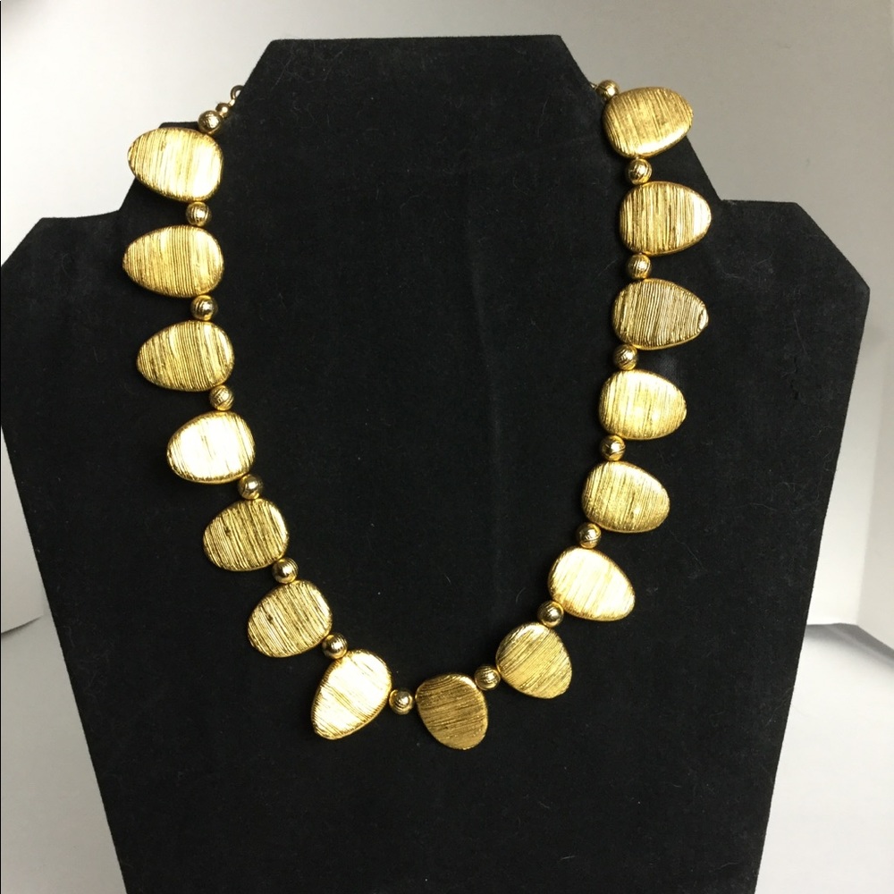 Gold tooth shaped necklace